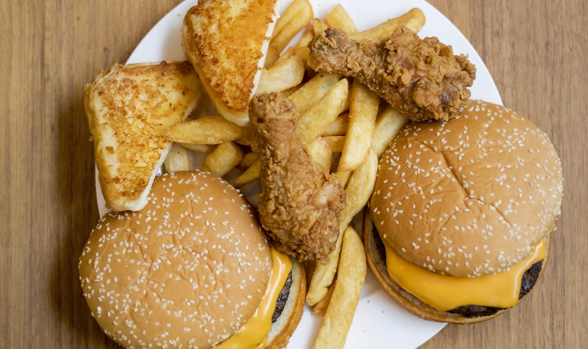 A plate full of fast food that would not help a trucker establish a healthy lifestyle